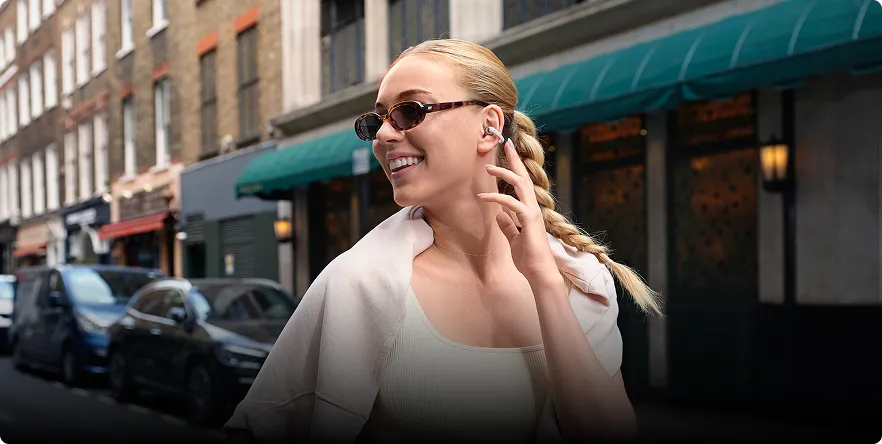 Écouteurs open-ear Shokz OPENDOTS ONE sans insertion intra-auriculaire, pour une hygiène et un confort durables.